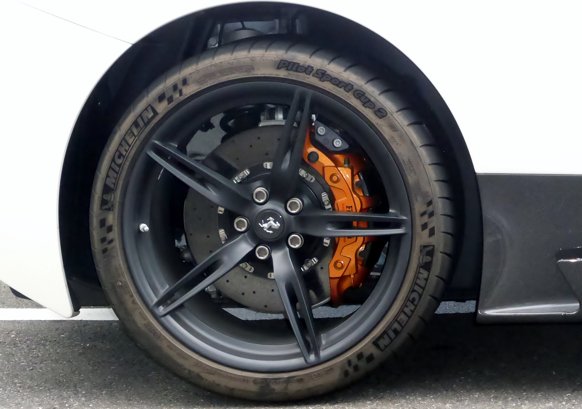 Forged wheel and yellow brake caliper of a Ferrari 458 Speciale.